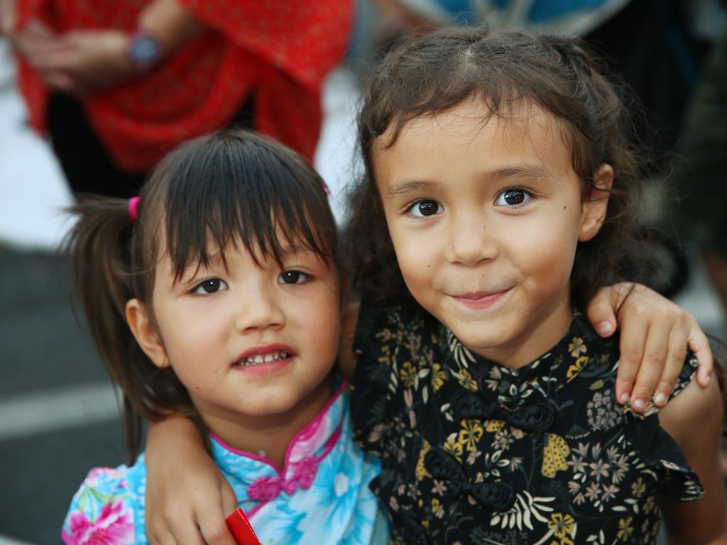 Sequoia Edwards, 4, and Vanessa Fitzgerald, 5, at the Cairns and District Chinese Association Inc Chinese New Year street festival on Grafton Street. PICTURE: BRENDAN RADKE