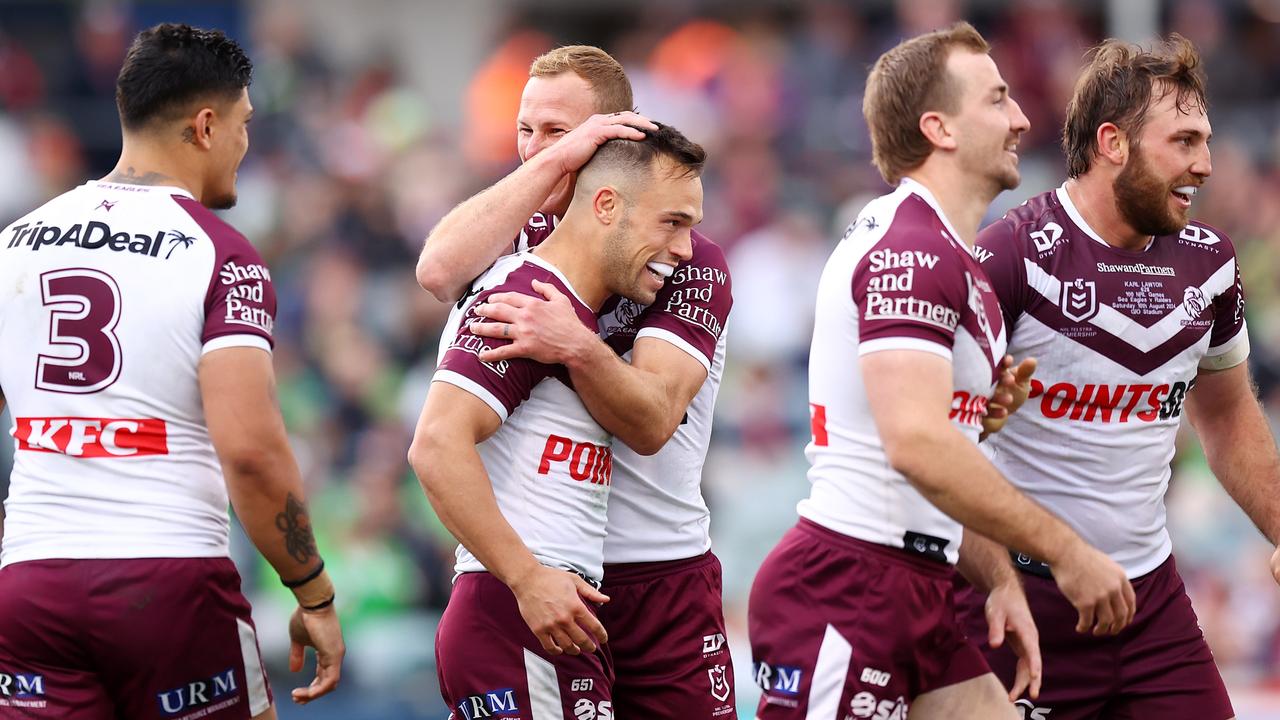 CANBERRA, AUSTRALIA - AUGUST 10: Luke Brooks of the Eagles celebrates scoring a try with team mates during the round 23 NRL match between Canberra Raiders and Manly Sea Eagles at GIO Stadium, on August 10, 2024, in Canberra, Australia. (Photo by Mark Nolan/Getty Images)