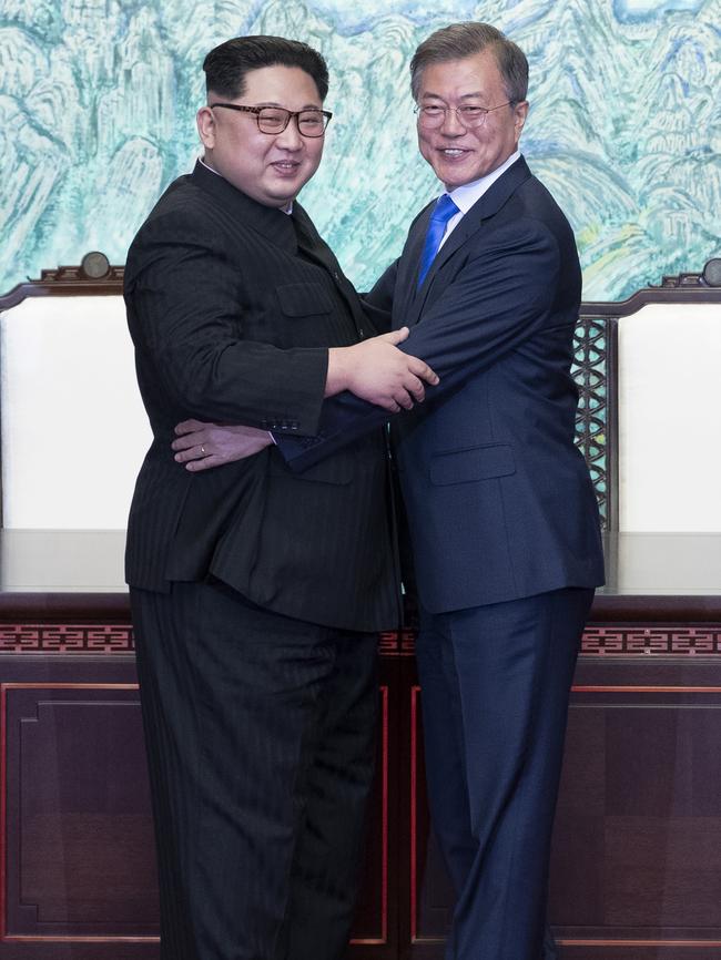 North Korean leader Kim Jong-un embraces South Korean President Moon Jae-in.