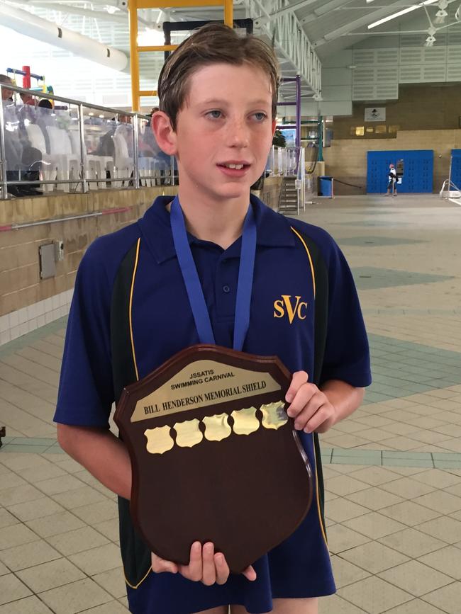 Tasmanian Olympic swimmer Max Giuliani as a student at St Virgil's College with a trophy from an interschool swim meet