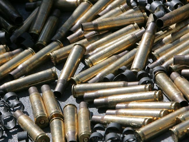 Spent cartridges from the 50 calibre machine guns lie on the deck of HMAS Ipswich after a weapons exercise off Moreton Island.Photo: The Queensland Times