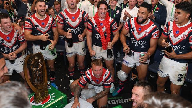 Roosters players celebrate their grand final win over the Raiders. Where’s the trainer? Picture: Dan Himbrechts/AAP