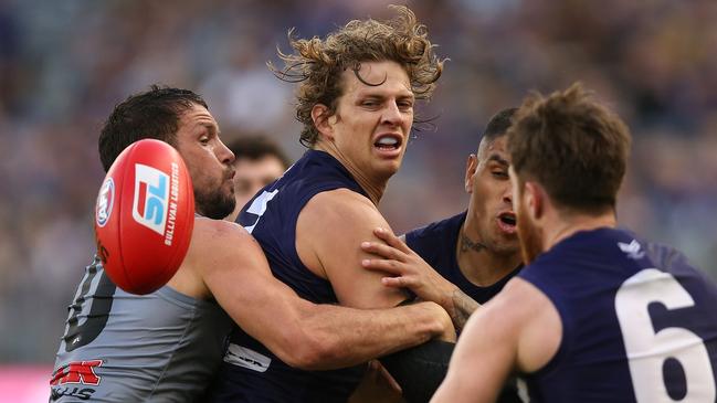 Port Adelaide’s Travis Boak tackles Fremantle’s Nathan Fyfe during the Round 13 AFL match at Optus Stadium. Picture: Paul Kane/Getty Images.