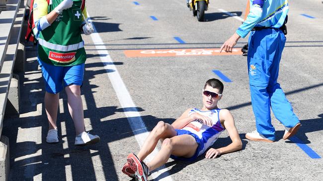 Callum Hawkins of Scotland as he collapses after being in the lead of the Men's Marathon Final on day eleven of competition at the XXI Commonwealth Games on the Gold Coast. Picture: AAP