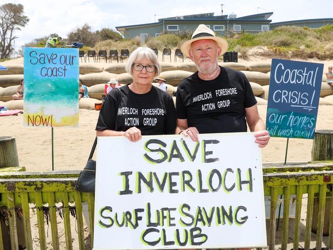 Gaynor and Paul Cross held signs up at the rally. Picture: Brendan Beckett