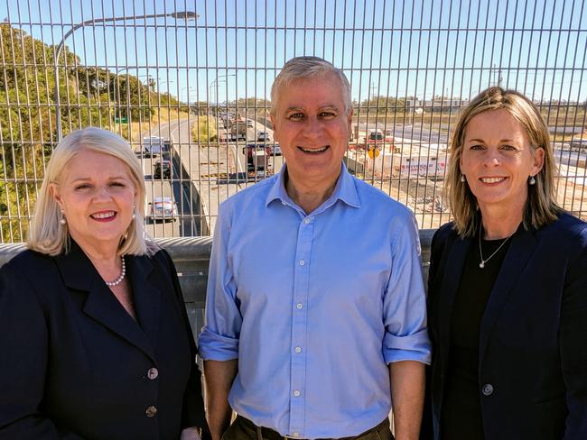 Member for McPherson Karen Andrews, Deputy Prime Minister Michael McCormack and Member for Moncrieff Angie Bell overlooking the M1 at Reedy Creek on Tuesday. Picture: Luke Mortimer