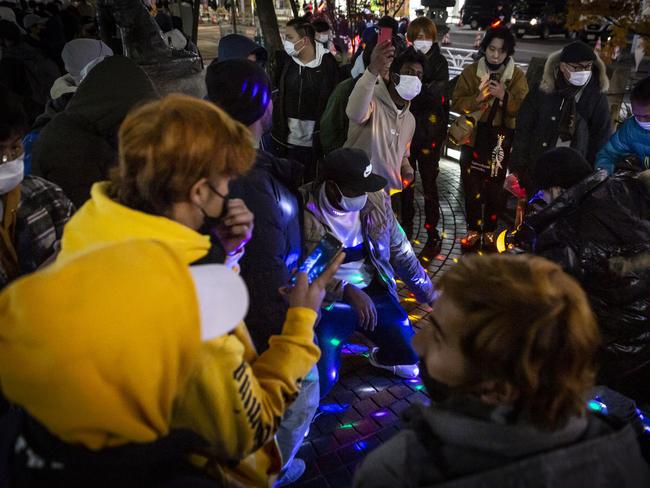 People dance to the music as they cerebrate New Year at Shibuya area on January 01, 2022 in Tokyo, Japan. Picture: Yuichi Yamazaki/Getty Images.