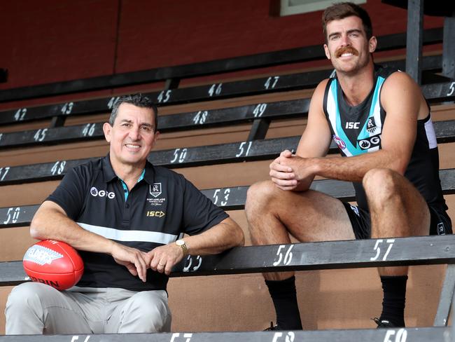 Former AFL Port Adelaide Football Club player David Hutton and AFL Port Adelaide Football Club player Scott Lycett poses for a portrait during a media opp at Alberton Oval in Adelaide, Wednesday, February 19, 2020. (AAP Image/Kelly Barnes) NO ARCHIVING