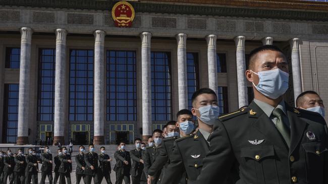 Chinese soldiers from the People's Liberation Army march after a ceremony marking the 70th anniversary of China's entry into the Korean War. Picture: Getty Images.