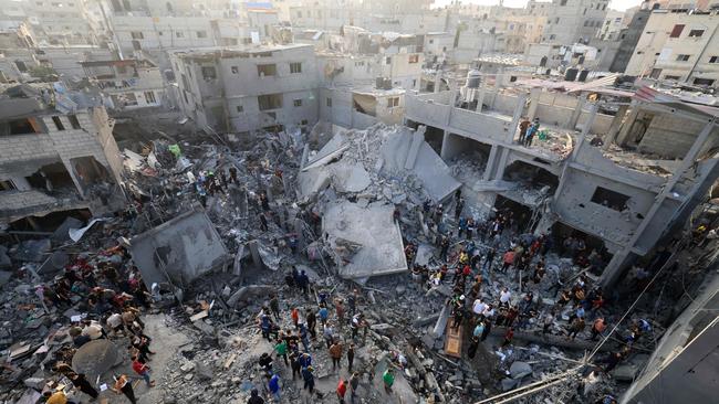 People check the damage caused by an Israeli strike on the Al-Maghazi refugee camp in Deir Balah in the central Gaza Strip on Sunday. Picture: AFP