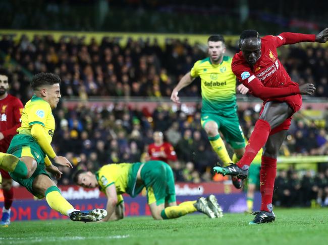 NORWICH, ENGLAND - FEBRUARY 15: Sadio Mane of Liverpool scores his team's first goal during the Premier League match between Norwich City and Liverpool FC at Carrow Road on February 15, 2020 in Norwich, United Kingdom. (Photo by Julian Finney/Getty Images)