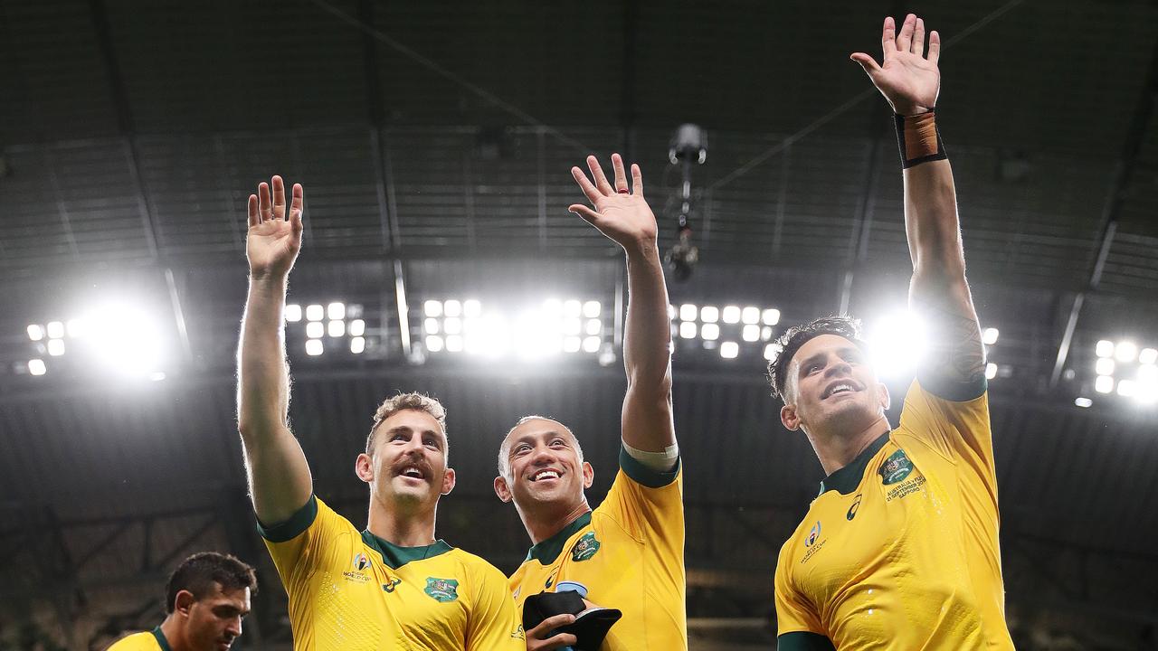 Nic White, Christian Lealiifano and Matt To'omua celebrates Australia’s win over Fiji. Picture: Getty Images