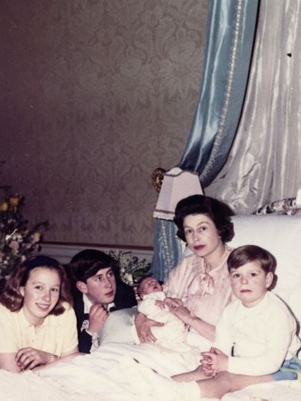 Queen Elizabeth II shortly after giving birth to Prince Edward in 1964., with her children (L) Princess Anne, Prince Charles and far right Prince Andrew.