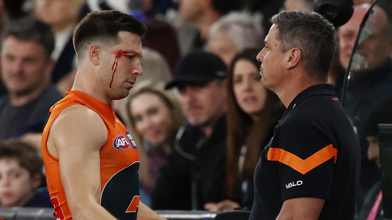 Toby Greene of the Giants walks past Adam Kingsley, Senior Coach of the Giants as he makes his way to the bench under the blood rule 2nd qtr during the round 24 match between Carlton and the Greater Western Sydney Giants at Marvel Stadium in Melbourne, Australia. Photo by Michael Klein.