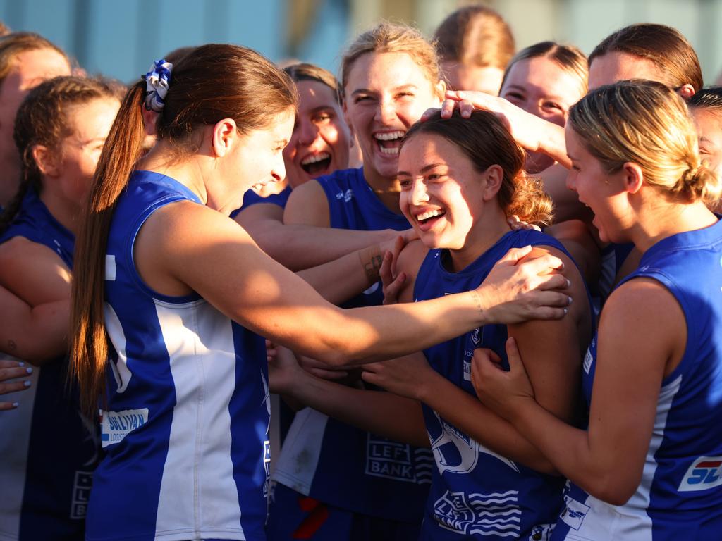 PERTH, AUSTRALIA - JULY 15: East Fremantle players celebrate Zipporah Fish of the Sharks winning best on ground during the WAFLW Grand Final match between Claremont and East Fremantle at Mineral Resources Park on July 15, 2023 in Perth, Australia. (Photo by James Worsfold/Getty Images)