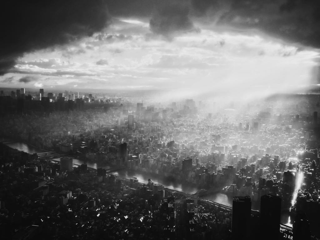 Image Name: East of the East. Photographer Name: Zhaoting Wu Year: 2018 Image Description: After the typhoon in Tokyo. The layers of clouds were lifted by lofty rays of light and the entire city bathed in light and shy stopped in the clear sky tree viewing platform and was moved by this stunning view. Copyright: Zhaoting Wu, China Mainland, Shortlist, Open Architecture and Winner, China National Award. Picture: Sony World Photography Awards/ Zhaoting Wu