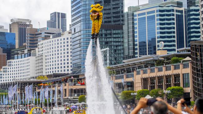 Lion Dancers practice on jet-packs before a performance at Darling Harbour during Lunar New Year’s celebrations in Sydney. Businesses in Western Harbour say the the precinct must be strengthened as an attraction for people to visit, work and live. Picture: Jeremy Piper