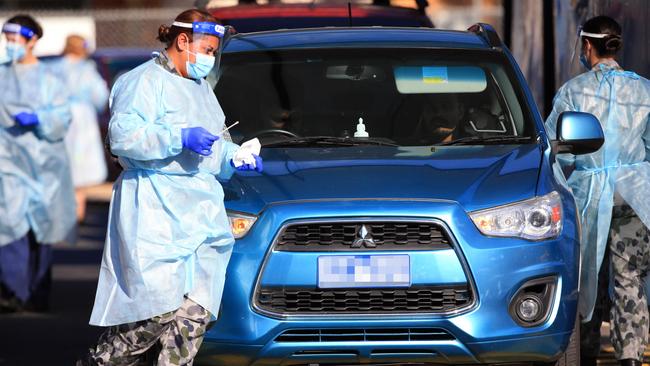 Australian Defence Force personnel at a COVID-19 testing site at Fawkner, in Melbourne’s north, on Sunday. Picture: Aaron Francis