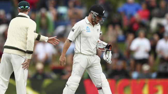Brendon McCullum (R) walks from the ground after playing his final Test innings.