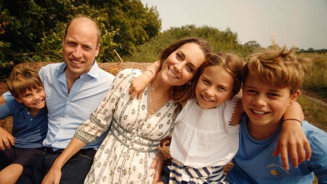 The family smile in the video. Picture: Will Warr/Kensington Palace/AFP