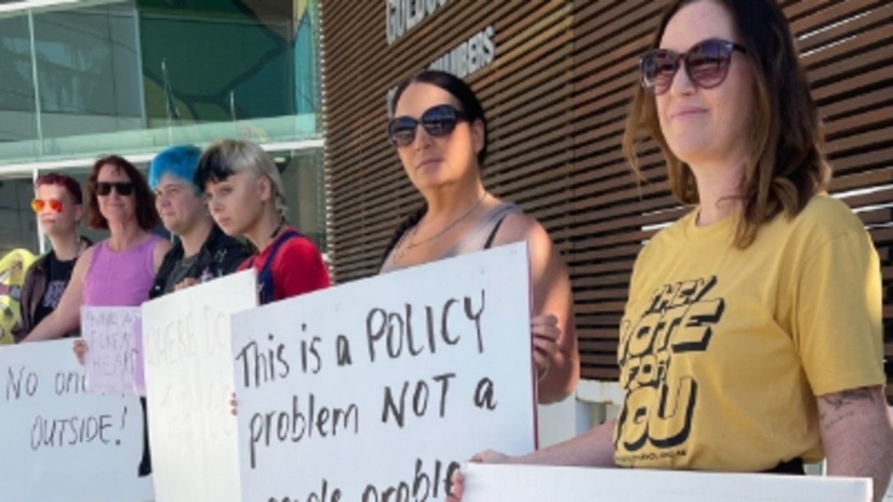 Supporters of the homeless at Carey Park stage a protest outside the Gold Coast City Council chambers about the City's tough compliance policy.