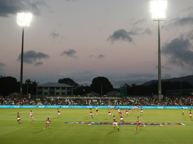 A reduced crowd of 4500 fans watch the AFL match at Cazalys Stadium.