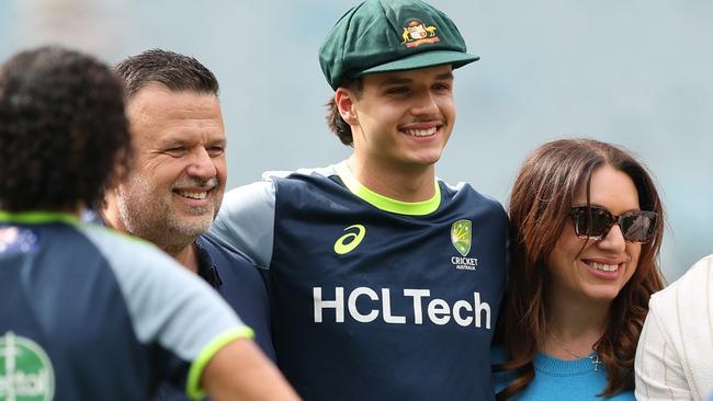 MELBOURNE, AUSTRALIA - DECEMBER 26: Sam Konstas of Australia poses for photographs after being presented with a Baggy Green during day one of the Men's Fourth Test Match in the series between Australia and India at Melbourne Cricket Ground on December 26, 2024 in Melbourne, Australia. (Photo by Robert Cianflone/Getty Images)