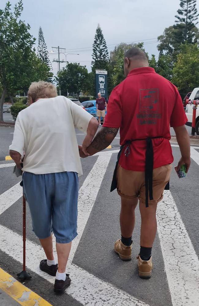 This Bunnings worker took his time guiding an elderly shopper to her car. Picture: Facebook