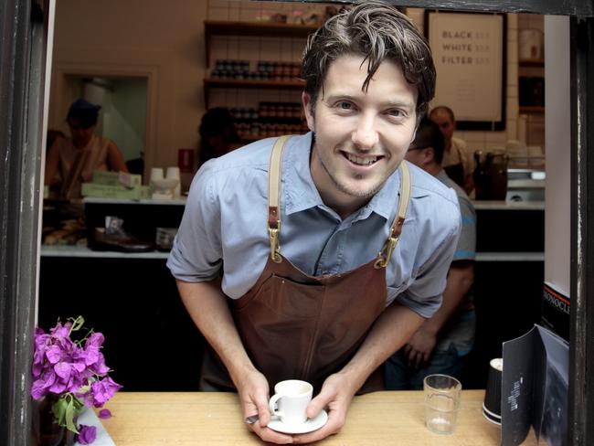 Bowen Holden serves up coffee with a smile at his coffee cafe Patricia.