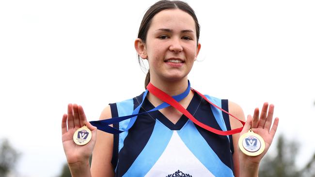 MELBOURNE, AUSTRALIA - AUGUST 10:  Neave Dickson of Sacred Heart College Geelong poses with her best on ground and winners medal following the 2023 Herald Sun Shield Intermediate Girls Grand Final match between Sacred Heart College Geelong and Carey Grammar at Trevor Barker Oval on August 10, 2023 in Melbourne, Australia. (Photo by Graham Denholm/AFL Photos via Getty Images)