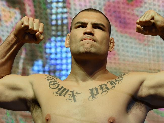 LAS VEGAS, NV - JULY 08: Mixed martial artists Cain Velasquez poses on the scale during his weigh-in for UFC 200 at T-Mobile Arena on July 8, 2016 in Las Vegas, Nevada. Velasquez will meet Travis Browne in a heavyweight bout on July 9 at T-Mobile Arena. (Photo by Ethan Miller/Getty Images)