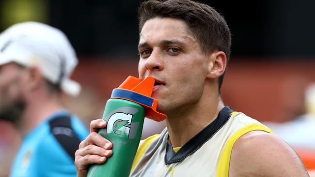 Dion Prestia has a drink during his comeback game. Picture: Mark Dadswell