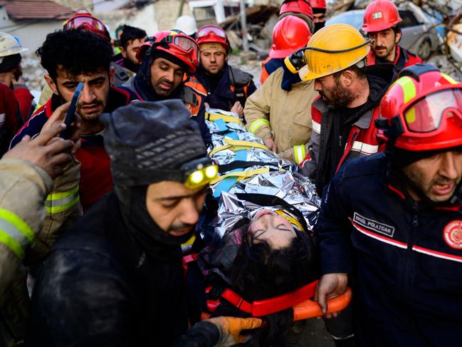 Rescuers evacuate a 12-year-old Syrian girl, Cudi, from the rubble of a destroyed building in Hatay. Picture: AFP