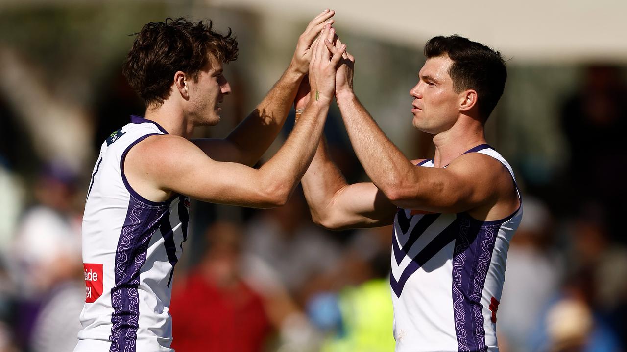 ALICE SPRINGS, AUSTRALIA - JUNE 02: Sam Sturt (left) and Jaeger O'Meara of the Dockers celebrate during the 2024 AFL Round 12 match between the Melbourne Demons and the Fremantle Dockers at TIO Traeger Park on June 02, 2024 in Alice Springs, Australia. (Photo by Michael Willson/AFL Photos via Getty Images)