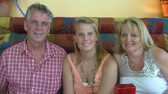 Maddie Riewoldt inbetween her mother Fiona and dad Joe Riewoldt at Christmas 2005.