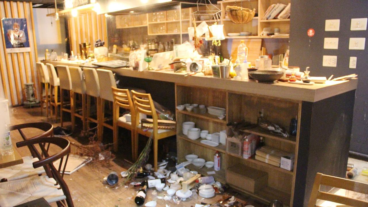 A picture shows tableware scattered on the ground at a restaurant following an earthquake, in Fukushima. Picture: AFP