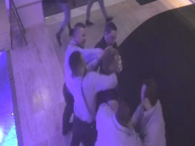 A still from CCTV footage showing a man being grabbed by bouncers at a Cairns casino.