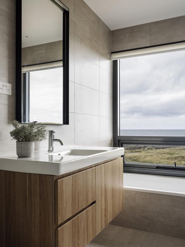 The main bathroom in Ettrick Rocks’ Australina retreat, complete with inset bath and stunning ocean view. Picture: Adam Gibson