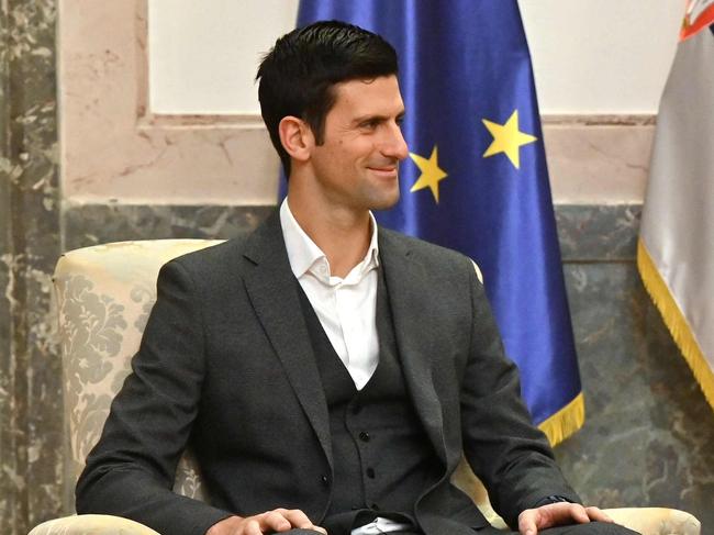 Serbian tennis player Novak Djokovic (L) meets Serbian President Aleksandar Vucic in Belgrade on February 3, 2022. - The 34-year-old world number one was unable to play in the Australian Open after being deported over Covid-19 vaccination issues, despite initially receiving an exemption from officials based on an positive PCR test weeks ahead of the tournament. (Photo by Andrej ISAKOVIC / AFP)