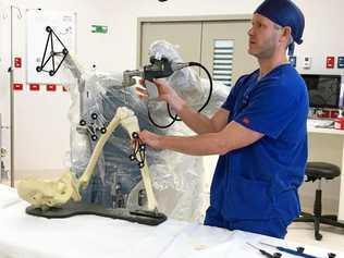 NEW TECH: Dr Alan Loch demonstrates St Vincent's Private Hospital Toowoomba's new orthopaedic robot. Picture: Contributed