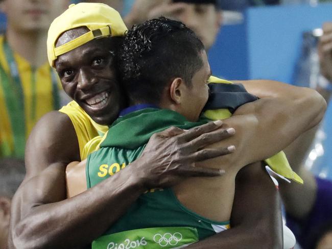 Usain Bolt congratulates Wayde van Niekerk.