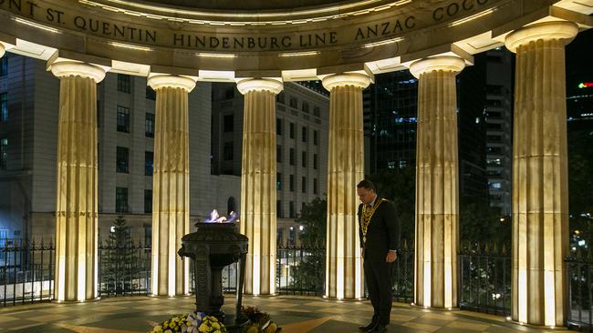 Brisbane Lord Mayor Adrian Schrinner has a moment at the Anzac Day Wreath Laying Ceremony at The Shrine of Remembrance in Brisbane, Saturday, April 25, 2019. Anzac Day is a national day of remembrance to commemorate the service and sacrifice of Australian and New Zealand service men and women. Due to COVID-19 restrictions marches and commemorative services have been banned for the first time in more than a century. (AAP Image/Jono Searle) NO ARCHIVING