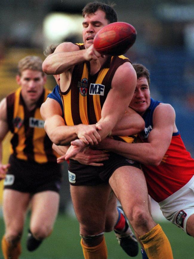 Jason Dunstall gets his handpass away against the Brisbane Bears in 1996.