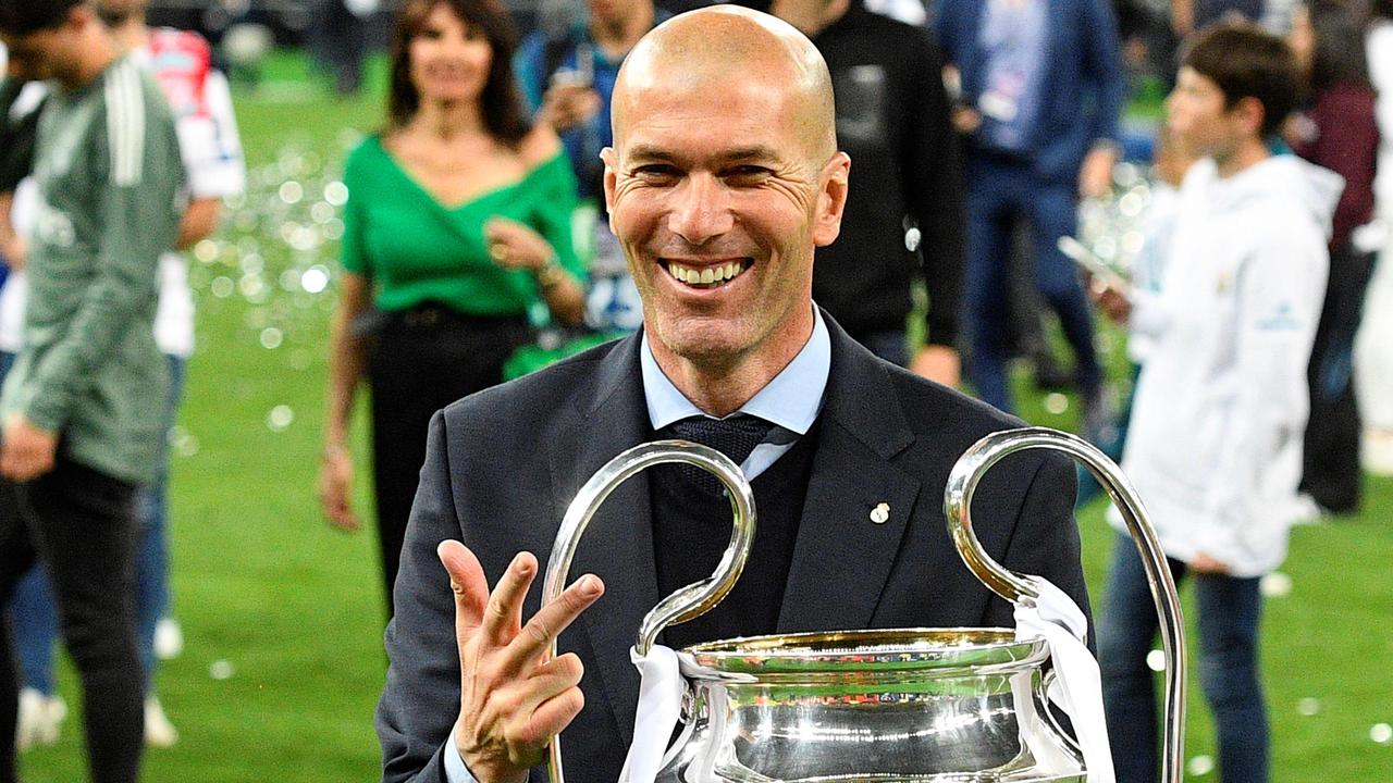 Zinedine Zidane poses with the  UEFA Champions League trophy. (Photo by GENYA SAVILOV / AFP)