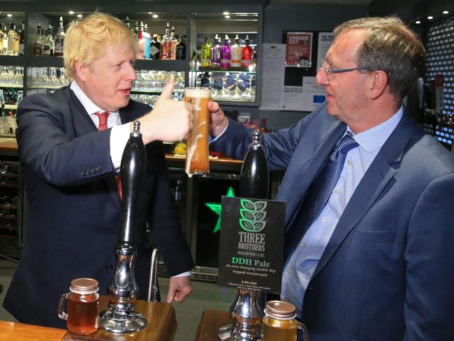 UK Prime Minister Boris Johnson after pulling a pint with newly elected Conservative party MP for Sedgefield, Paul Howell. Picture: AFP