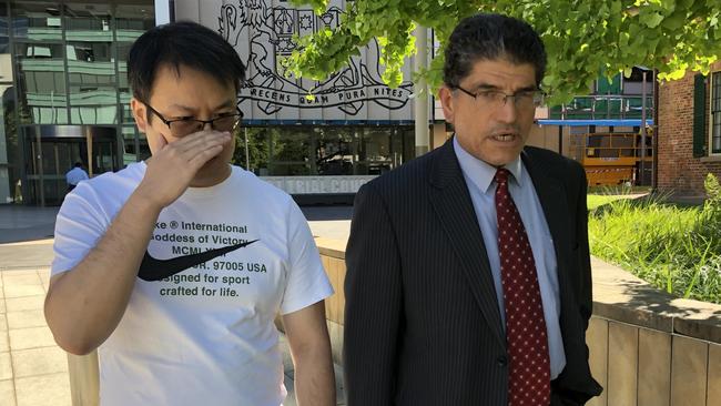 Liang Zhang, left, and his lawyer Dominic Oliveri leave Parramatta District Court after pleading not guilty to dealing with the proceeds of crime in connection to what the AFP allege is a multimillion-dollar money laundering plot. Picture: Rhiannon Down/The Australian