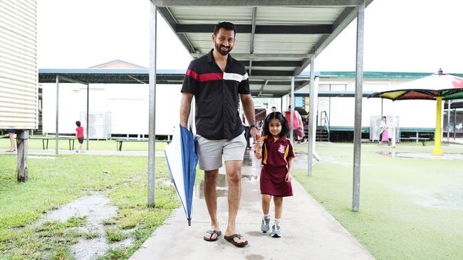 Anoop Parameswaran helps her daughter Aavani Anoop, 4, to her class on her first day of prep at Edge Hill State School. Picture: Brendan Radke