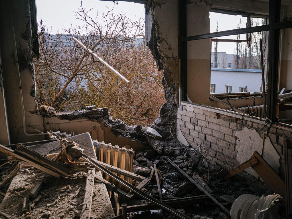 This photograph taken on January 1, 2023, shows an inside view of a damaged room of the of a hospital in Ukraine after a Russian missile strike in the southern city of Kherson. (Photo by Dimitar DILKOFF / AFP)