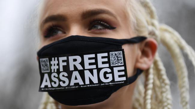 Julian Assange supporter Nina from Amsterdam wears a mask calling for his freedom outside Woolwich Crown Court in southeast London. Picture: AFP