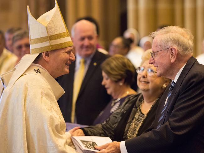 Archbishop Anthony Fisher celebrating Mass after nearly six months with his parents Gloria and Colin Fisher. Picture: Supplied